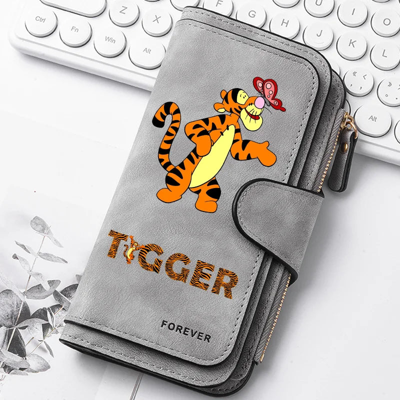 A gray zippered pouch featuring an orange and black tiger illustration and the word forever on the front.