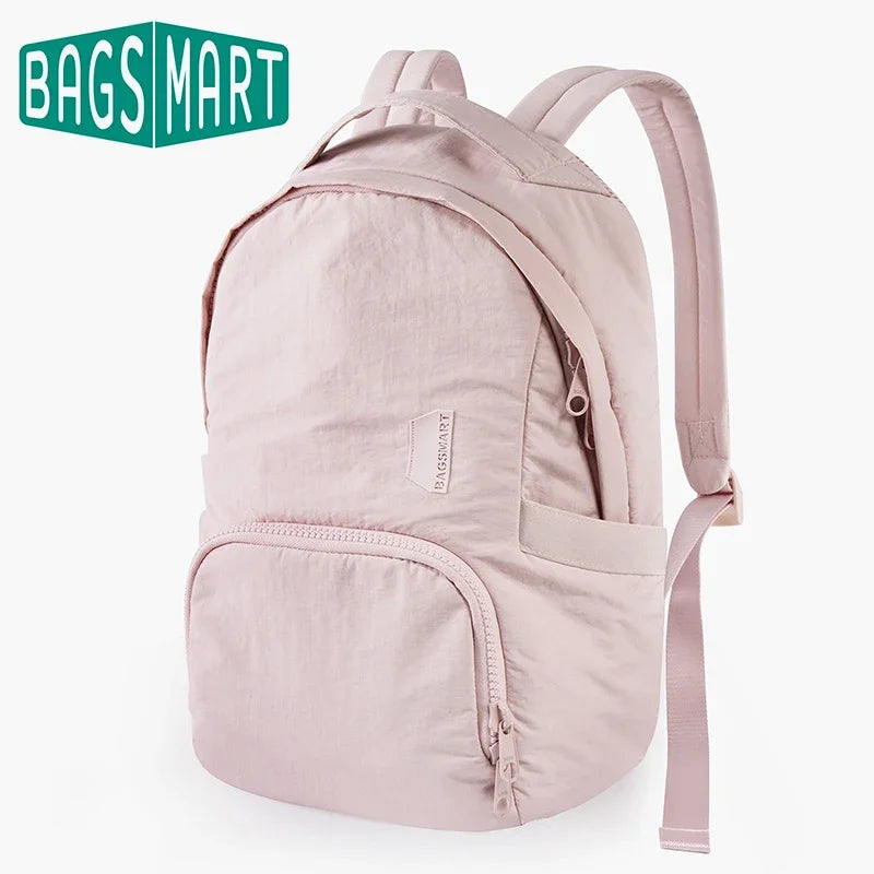 A light pink waterproof anti-theft laptop backpack with a beige strap and fabric details.