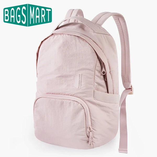 A light pink waterproof anti-theft laptop backpack with a beige strap and fabric details.