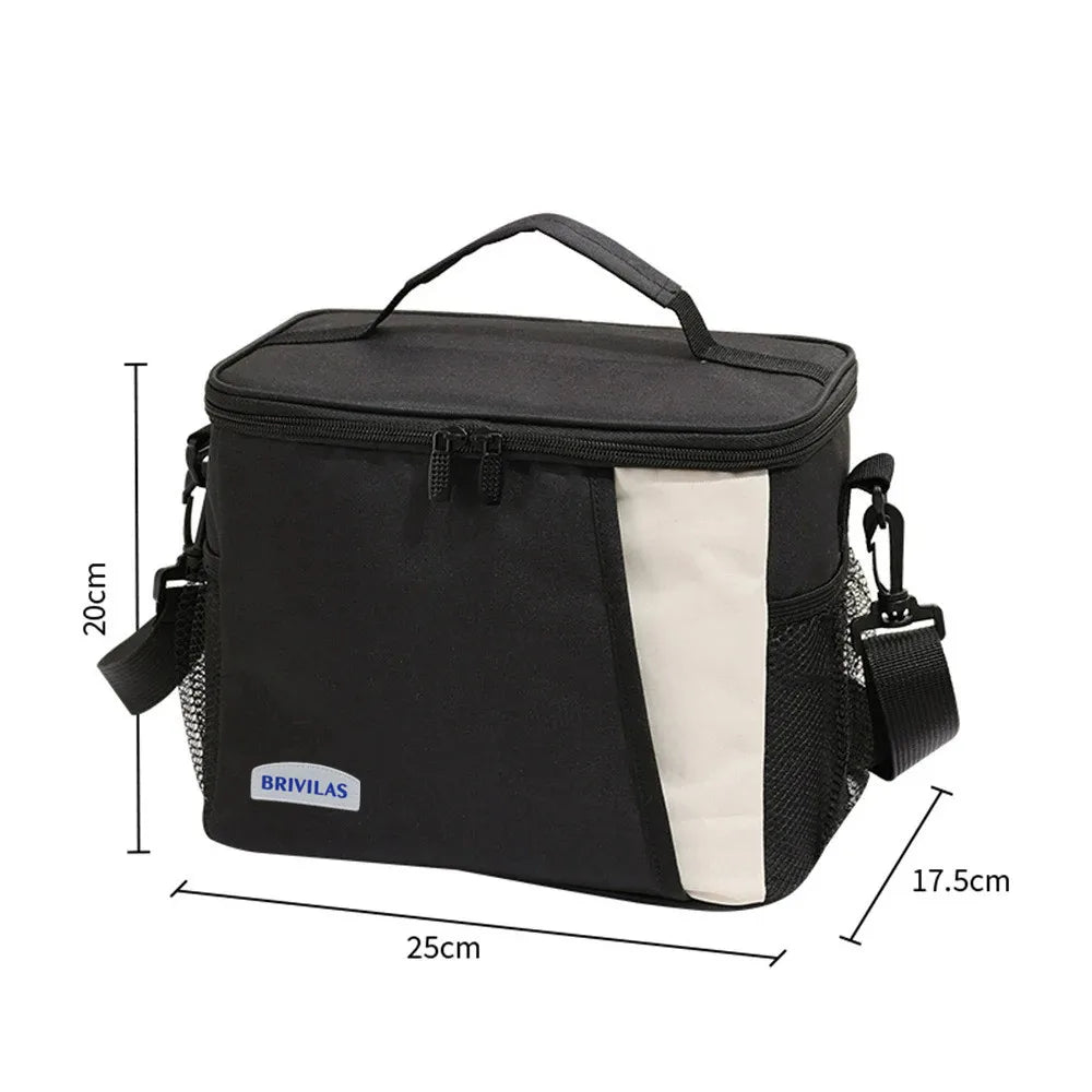Black insulated reusable lunch bag with a light gray accent panel and adjustable strap.