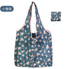 A reusable eco tote shopping bag in blue and pink floral pattern.