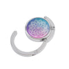 Silver folding table bag hook with a circular pendant featuring a purple and blue marble starry sky design