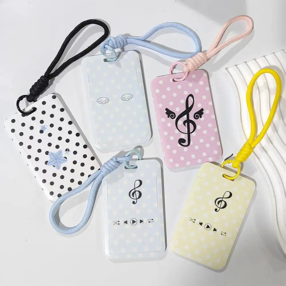A collection of pastel-colored card holders with musical notes and polka dots attached to colorful lanyards.