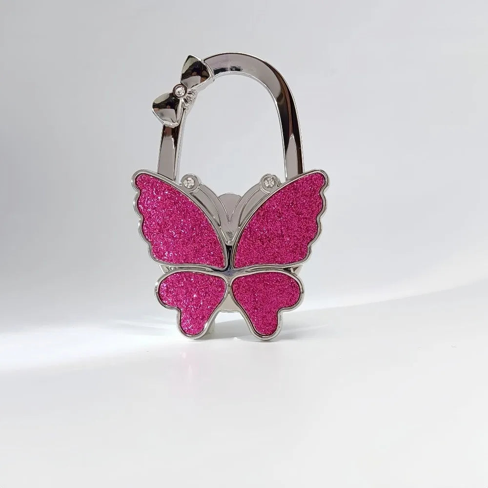 Silver butterfly shaped handbag hook with glitter pink wings
