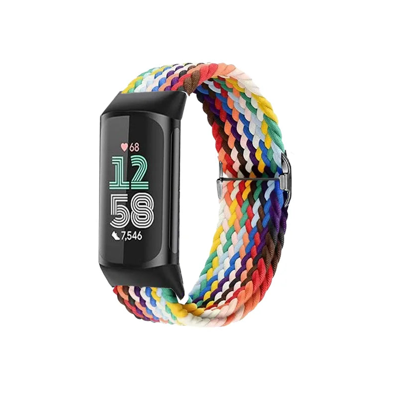 A black Fitbit watch with a colorful stretchy nylon watch band wrapped around it.