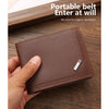 A brown leather belt wallet with a money clip is held in a hand on a wooden surface.