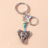 Silver gothic steampunk heart keychain with a sun eye pendant