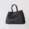 A black genuine leather women's shoulder tote bag with a top handle shown from the front.