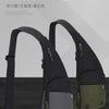 A black and olive green sling bag is shown against a gray background, highlighting its adjustable strap and pocket details.