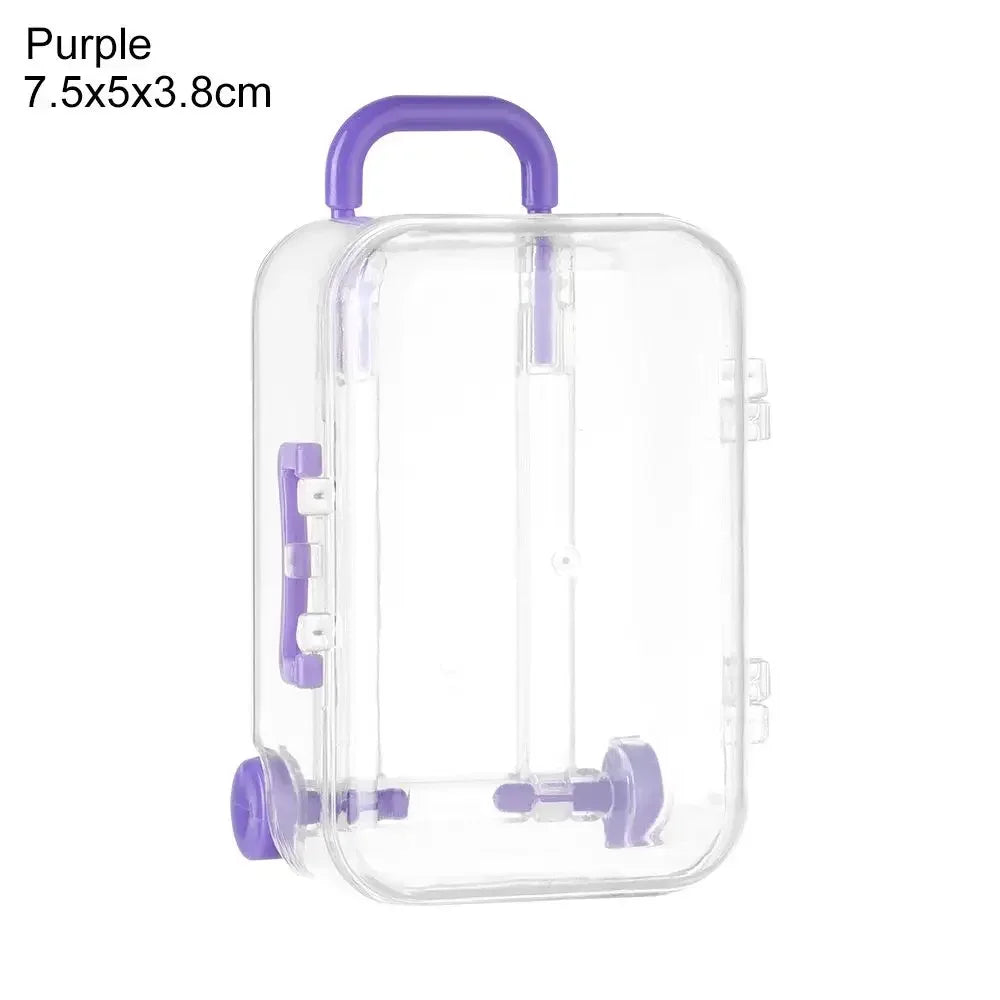 A clear purple miniature doll suitcase with a handle and latch.