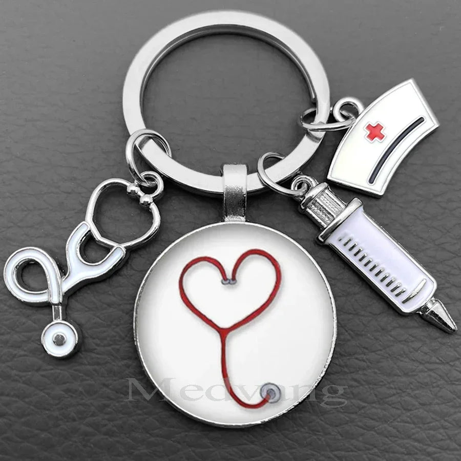 Silver keychain featuring a heart stethoscope charm and a medical syringe.