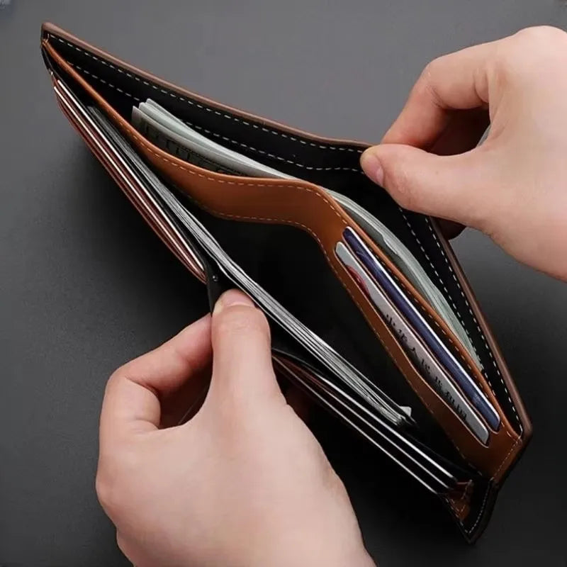 A hand is opening a brown leather men's stripe multi-function wallet to view the contents.