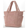A light pink canvas shoulder bag featuring a Snoopy cartoon design.