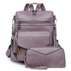 A mauve retro PU leather travel backpack featuring zippered compartments and a tassel detail.