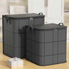 Two large gray foldable non-woven storage bags standing next to a white cabinet.