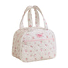 A pink quilted insulated lunch tote bag with white fabric and pink trim.