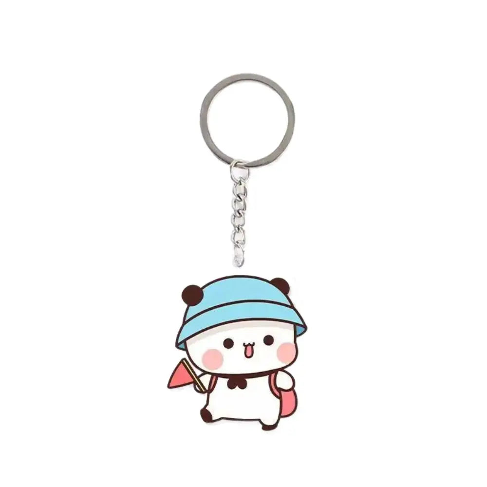 A cute cartoon character keychain charm featuring a blue hat and white body.