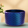 A deep blue textured silicone boot sleeve designed to protect water bottles.