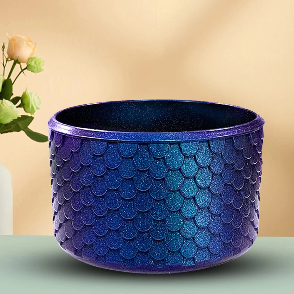 A deep blue textured silicone boot sleeve designed to protect water bottles.