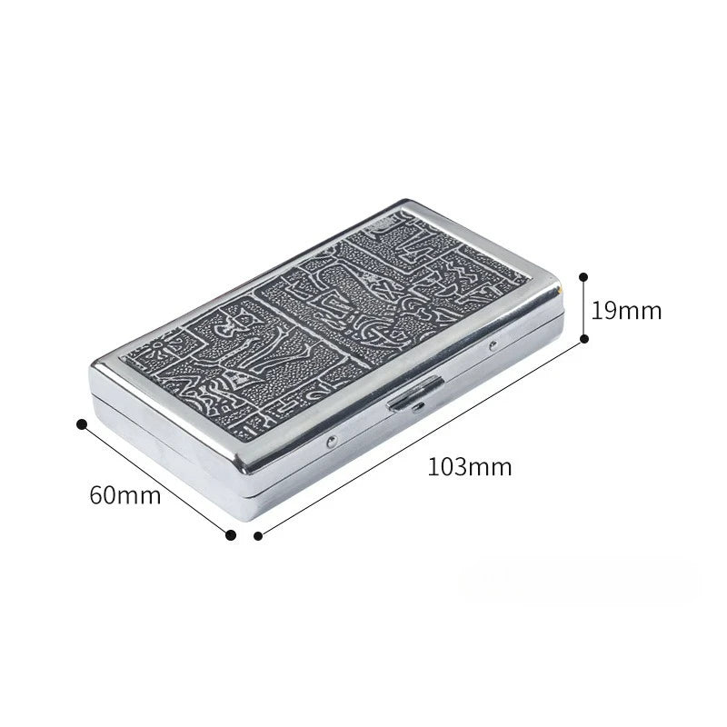 A silver metal cigarette case holder with intricate engraving, shown from above.