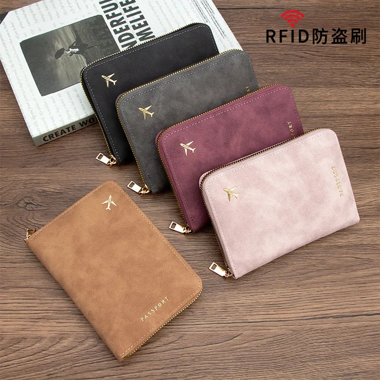 A collection of five slim RFID blocking passport wallets in various colors, including black, gray, purple, and beige, display