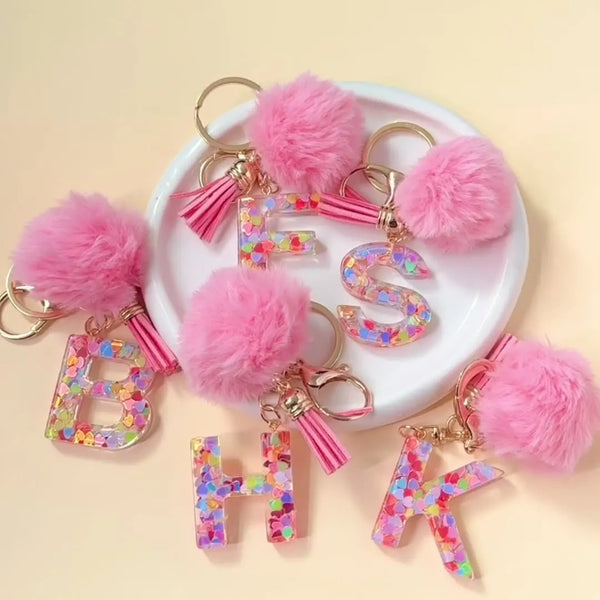 Pink fuzzy initial letter keychain charms in resin for bags and backpacks