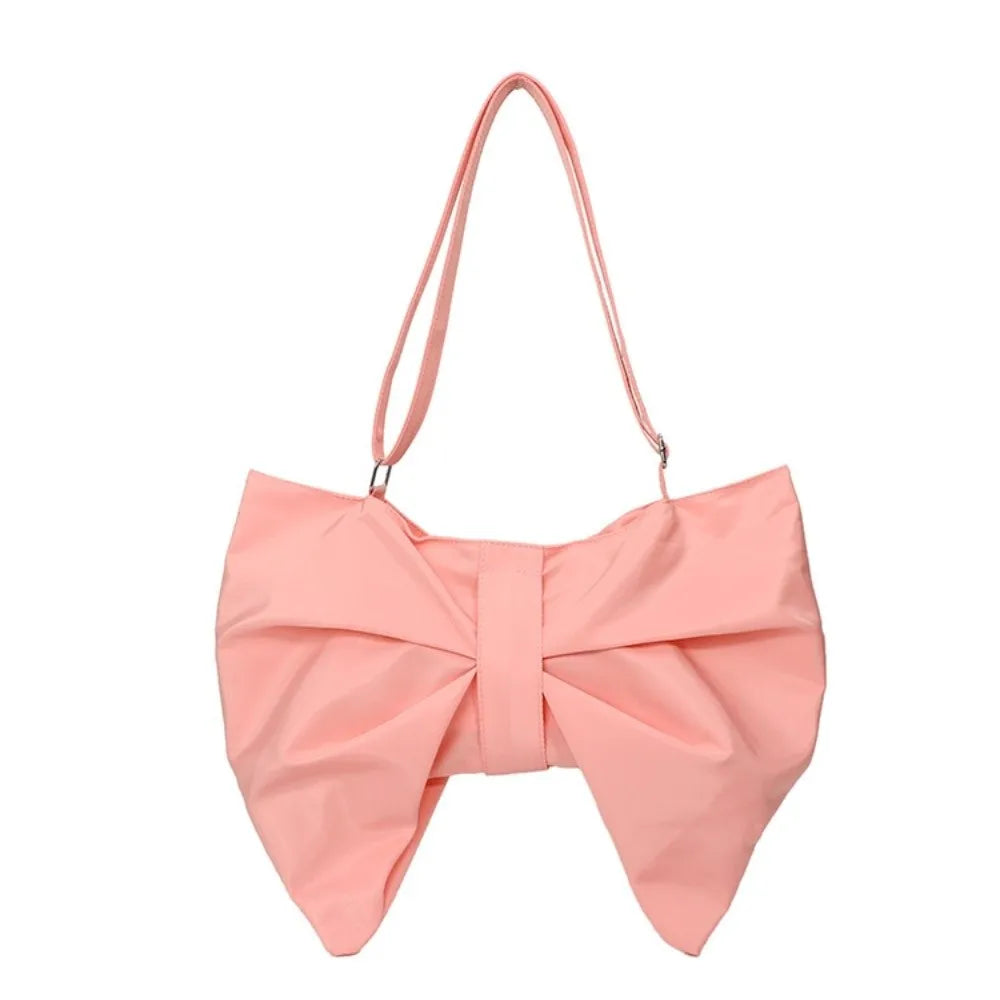 A light pink elegant pleated bow crossbody tote bag.