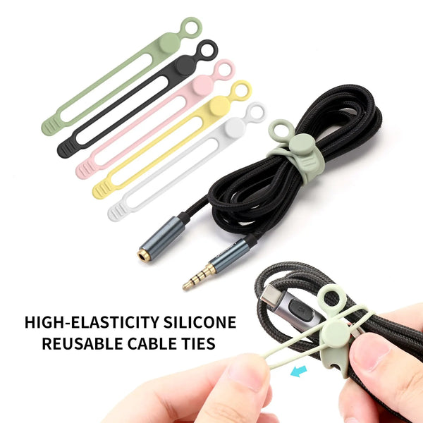A collection of high-elasticity silicone reusable cable ties in various colors and a black cord organizer being held by a han