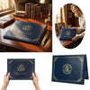 A dark blue elegant birth certificate holder with a gold seal and leather cover displayed on a wooden desk.
