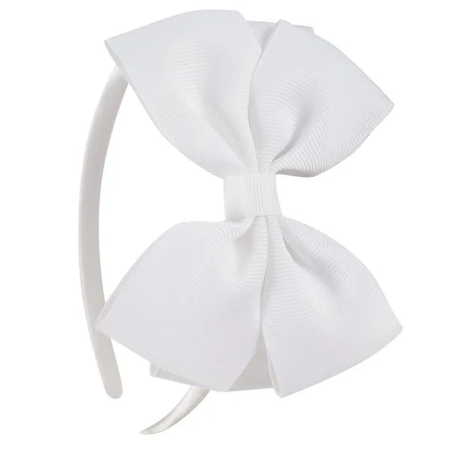 A white bow hairband is shown against a white background.