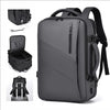A gray expandable travel backpack shown with various features including a laptop sleeve and organizational pockets.