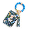 A silicone bead and PU leather key chain wallet featuring a floral pattern and tassel.
