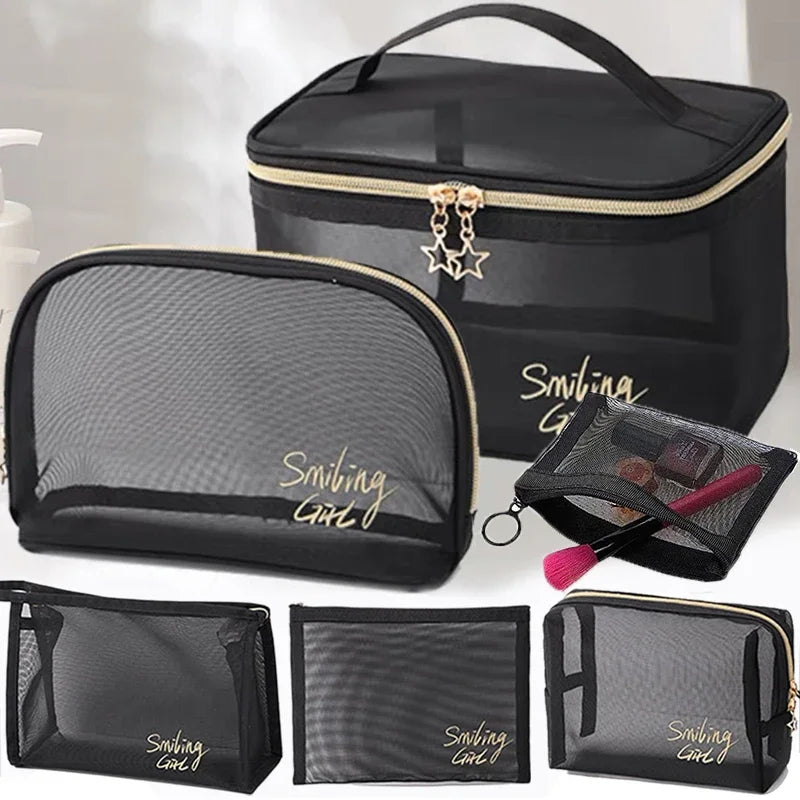 Black mesh cosmetic storage pouches and a large black travel case with gold accents