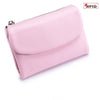 A pink genuine leather mini card holder wallet with a silver zipper visible.