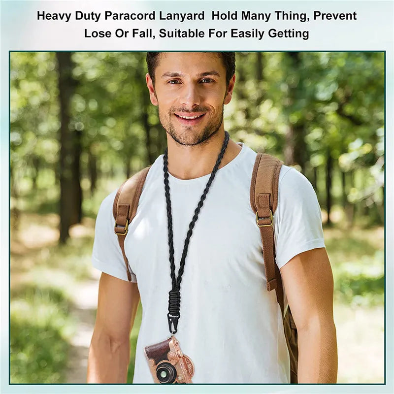 A man wearing a white t-shirt and brown backpack demonstrates a heavy duty paracord lanyard with a metal hook.