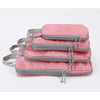 A set of four pink and gray vertical travel organizer bags stacked together.