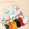 A collection of colorful, heart-shaped PU leather keychains in pastel and vibrant shades displayed on a light background.