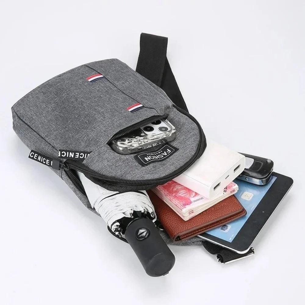 A gray waterproof crossbody fanny pack with a red and white flag detail is shown alongside a smartphone and wallet.