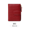 A deep red women's PU leather bifold wallet with a quilted texture and zipper closure.