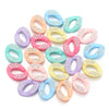 A collection of colorful acrylic link chain connectors in various pastel shades and glitter finishes.
