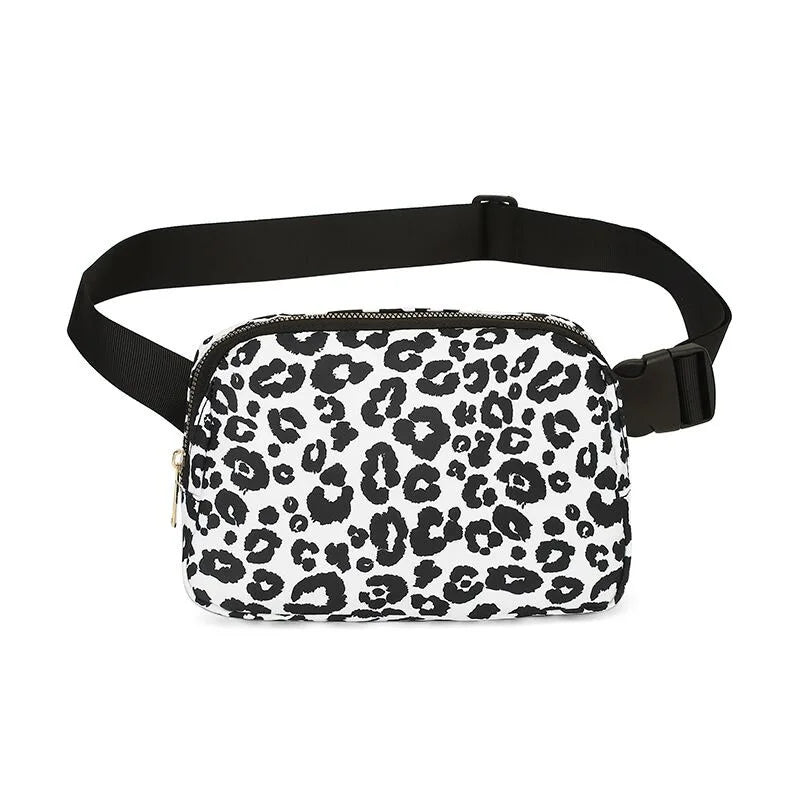 Black and white leopard print waist bag or fanny pack with a black strap