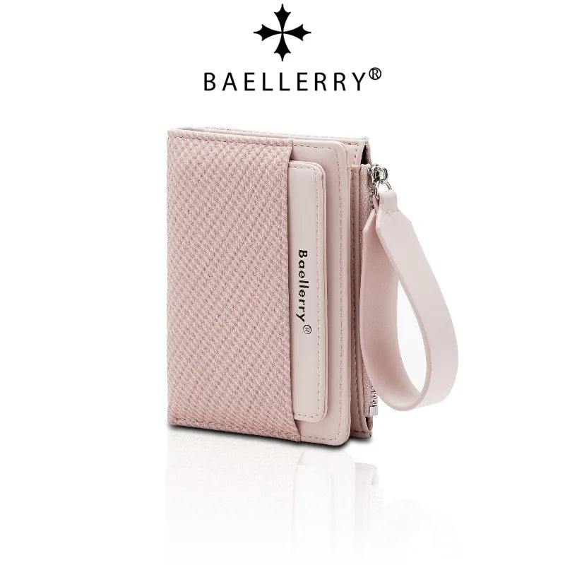 A light pink Baellerry zip-around wallet with card slots and a leather strap.