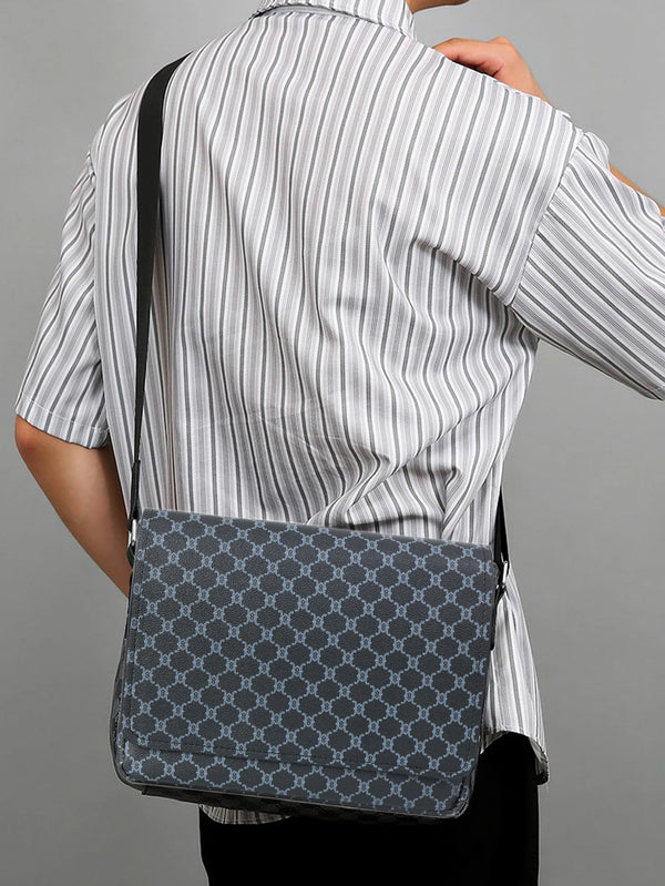 A woman wearing a striped shirt holds a gray patterned flap crossbody bag.