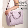A woman holds a light purple quilted insulated lunch bag, demonstrating its lightweight and easy to eat features.