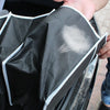 A hand is folding a black and gray multi-pocket car trunk organizer with a foldable design.