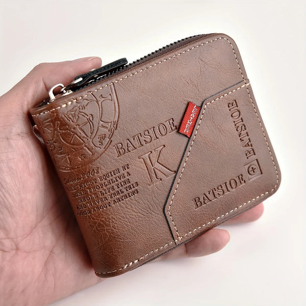 A brown slim PU leather wallet with a zipper closure is held in a hand.