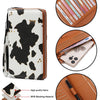 A black and white cow print wallet made of polyester fabric with RFID blocking material.