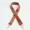 A brown nylon adjustable shoulder strap with a metal buckle and clasps.