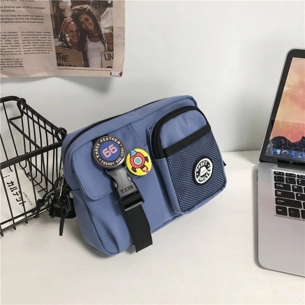 A light blue quick-dry canvas shoulder bag with black trim and a leather strap resting on a white surface.