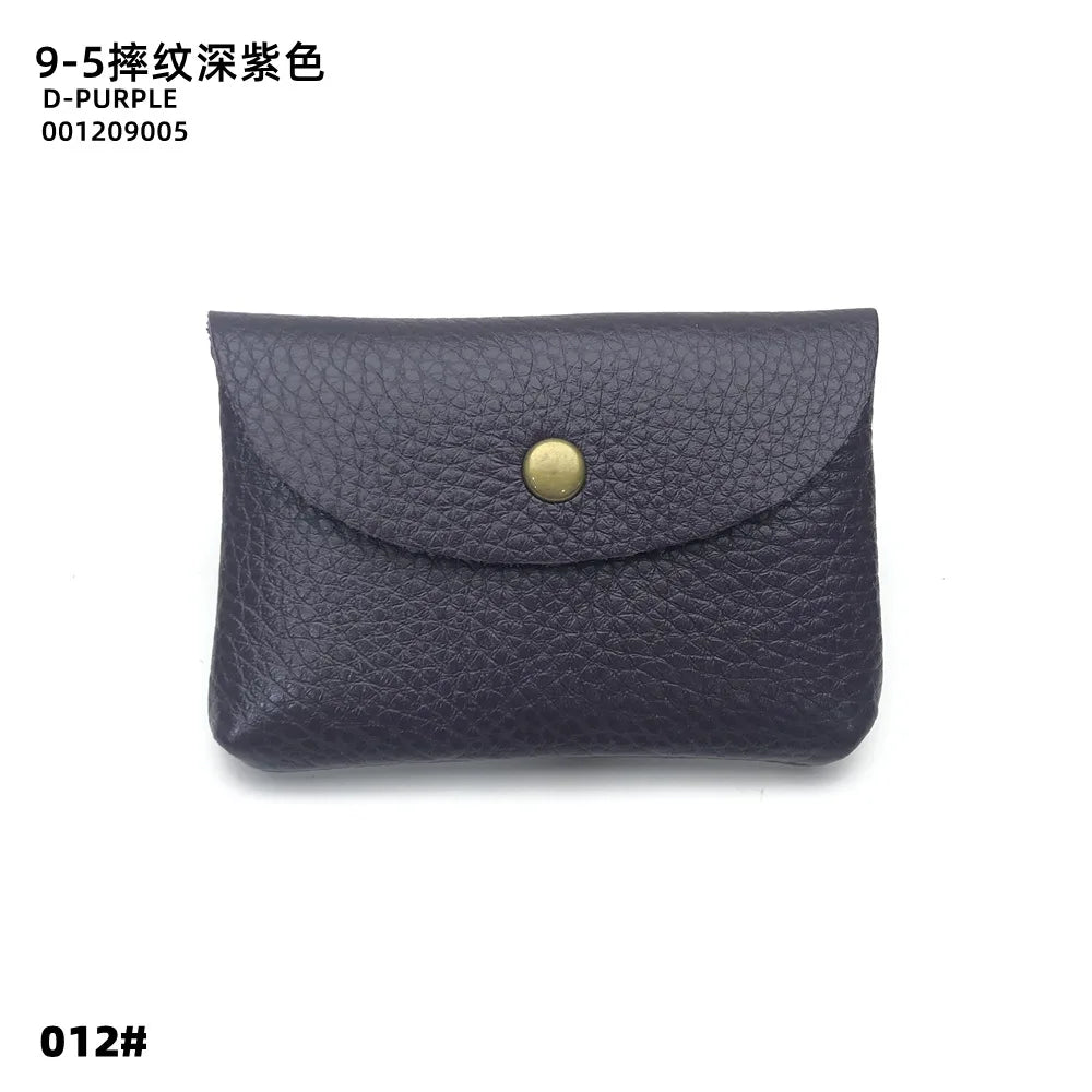 A dark purple genuine leather card holder with a gold-toned clasp.